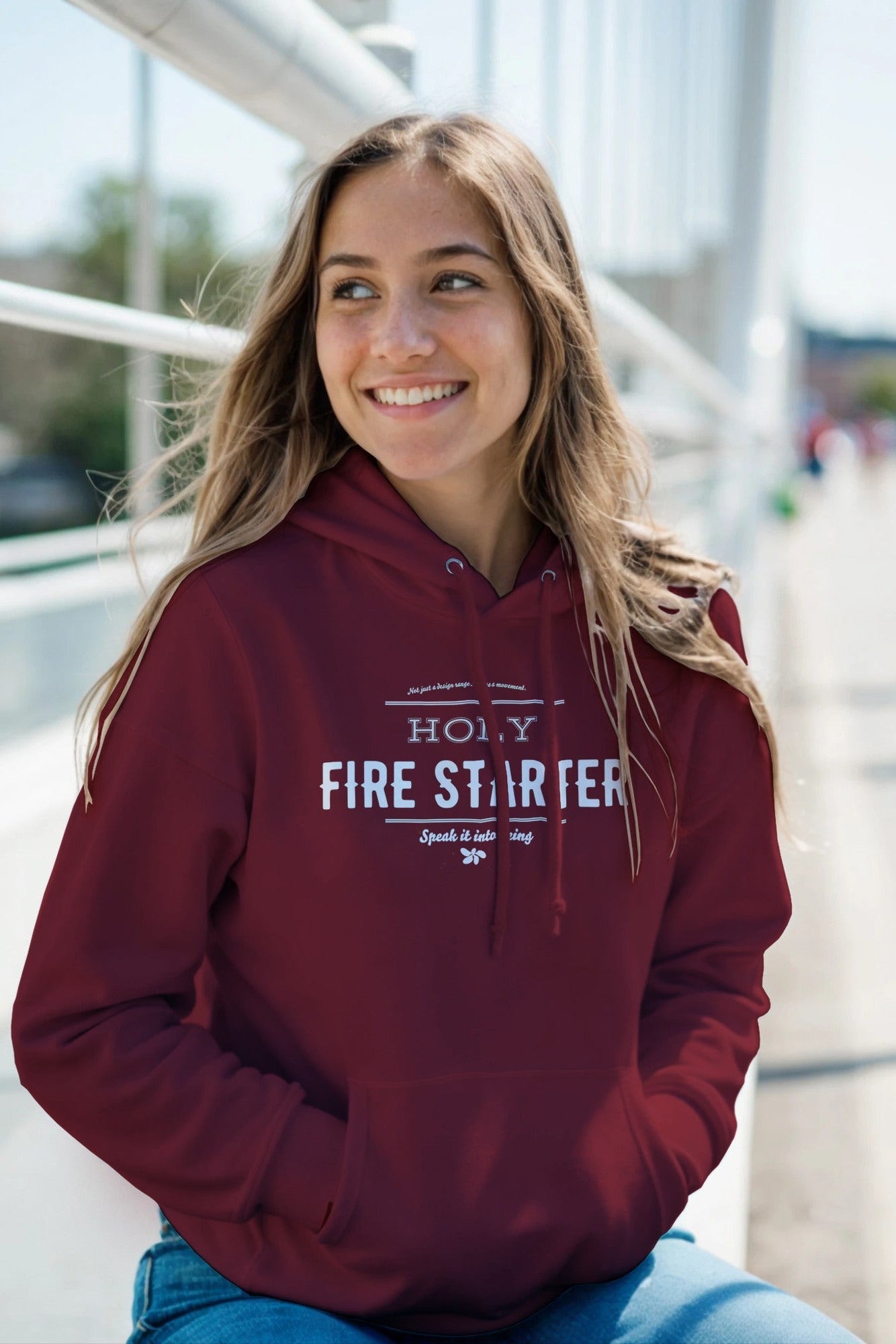 beautiful smiling young woman wearing Holy Firestarter hoodie