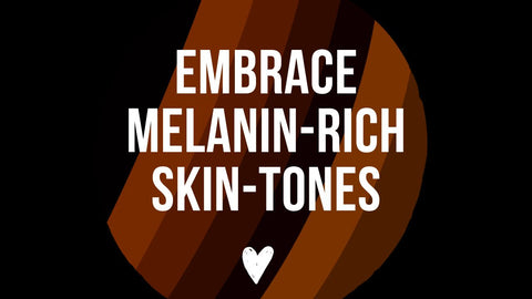 Embrace Melanin globe with the words Embrace melanin-rich skin-tones with a white heart below against a black background.
