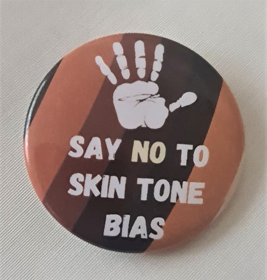 Embrace Melanin globe with a white palm print and the words, say no to skin tone bias.